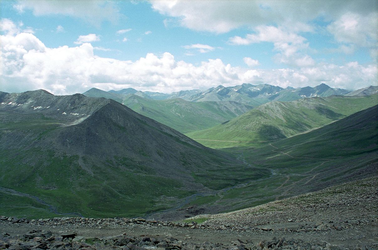 05 Babusar Pass Looking Back The Road Towards Chilas We have a couple of short delays with a broken down tractor, a road plow, and a donkey. We make good time and reach Babusar Pass (4173m) in two and a half hours from Chilas.